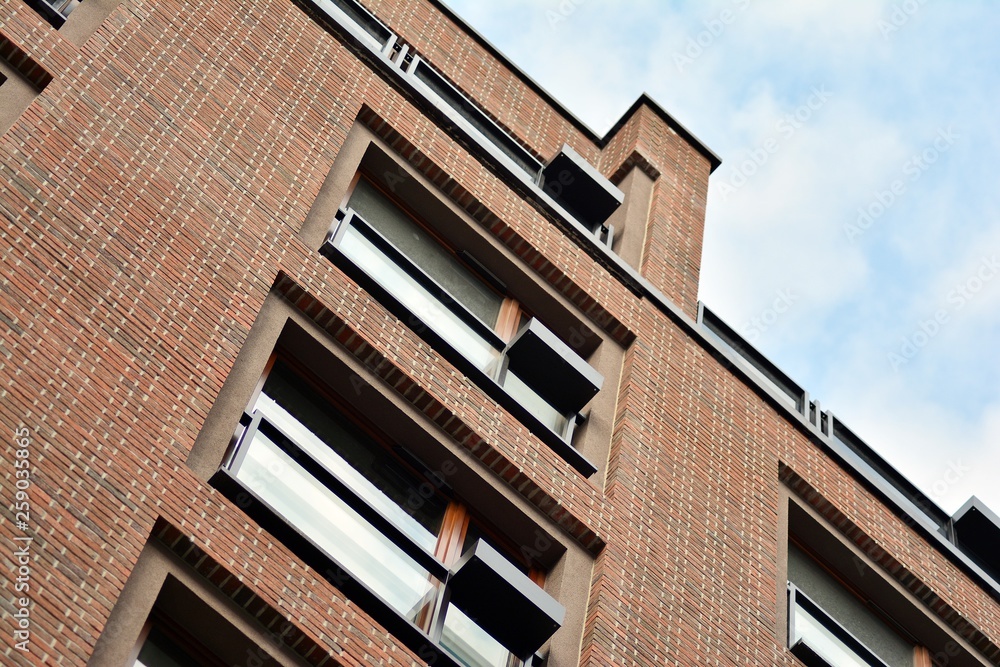 Fragment of a modern apartment building in front. Very modern apartment house.