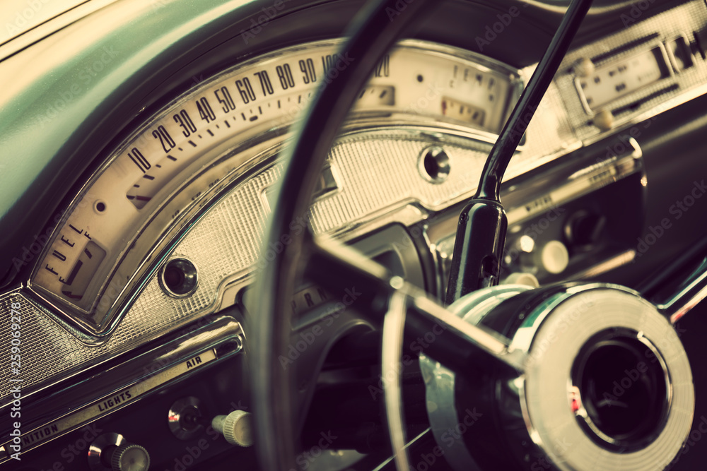 Classic car interior with close-up on steering wheel