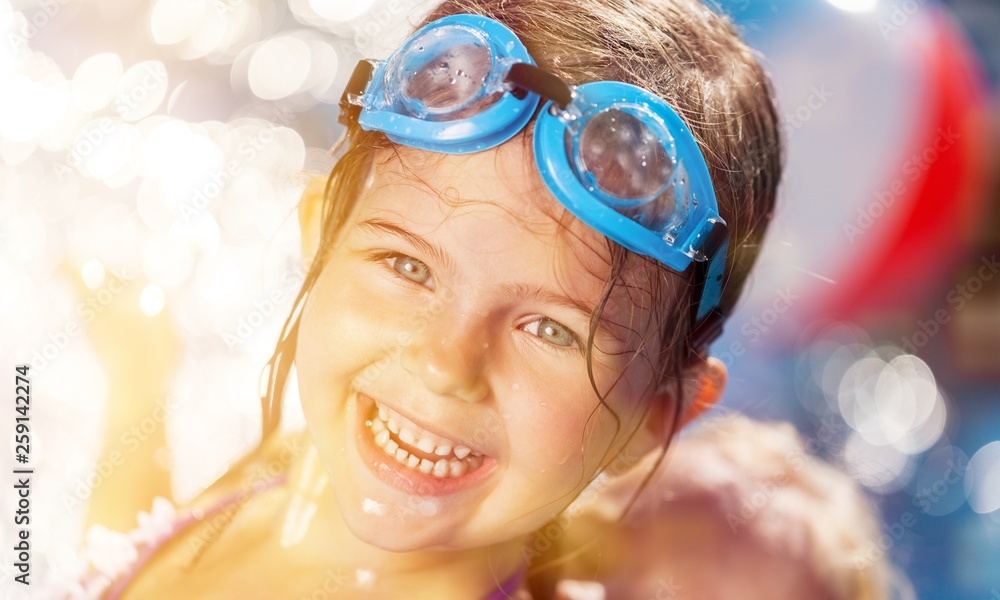 Beautiful little girl sunning at the pool