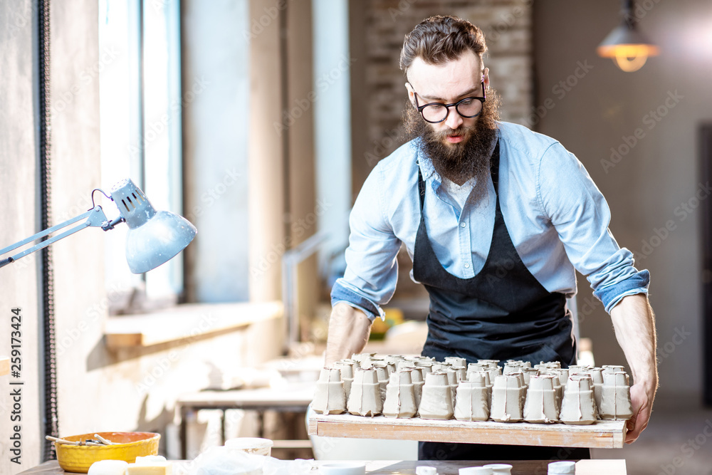 Man working with ceramics at the pottery