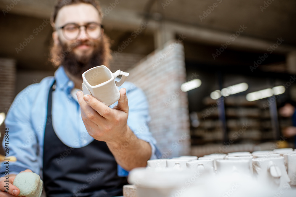 Man working with ceramics at the pottery