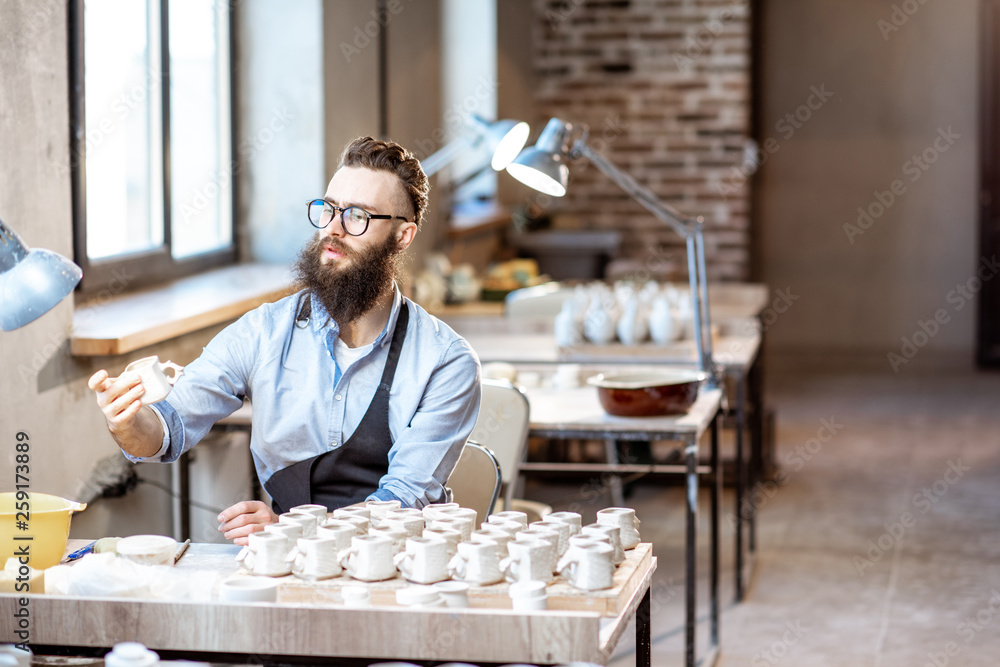 Man working with ceramics at the pottery