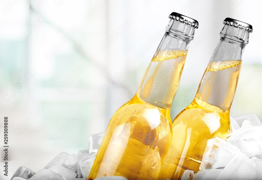 Cold beer with foam in glasses, close-up