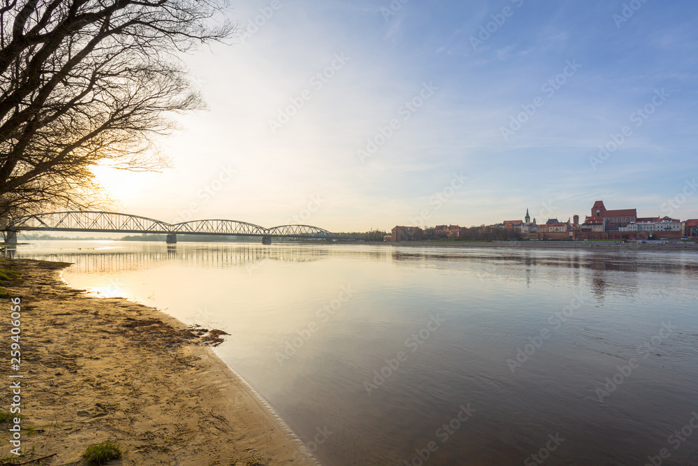 Old bridge over Vistula river in Torun at sunset, Poland