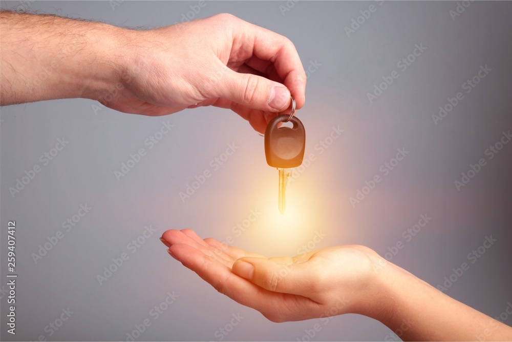 Key car key human hands designated driver concept car rental holding