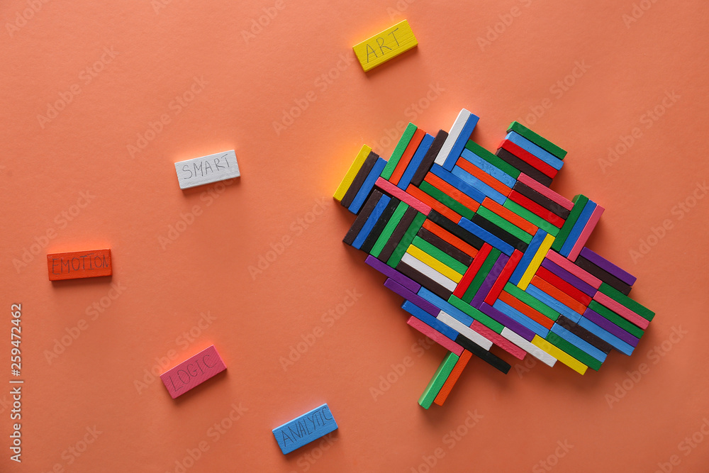 Brain composed from colorful blocks on color background