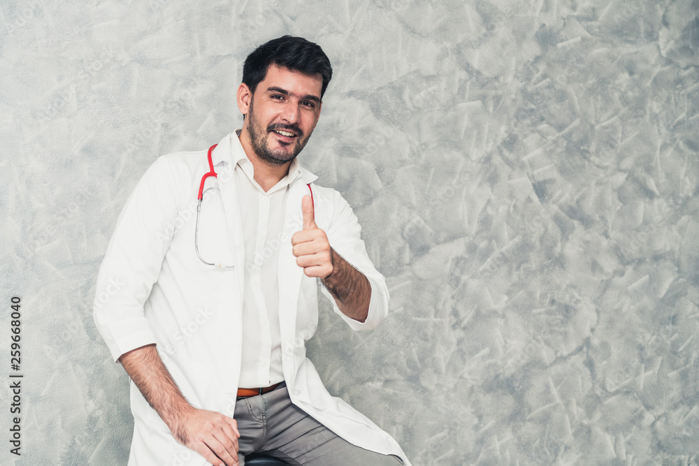 Young male doctor working at the hospital. Medical healthcare and doctor staff service.