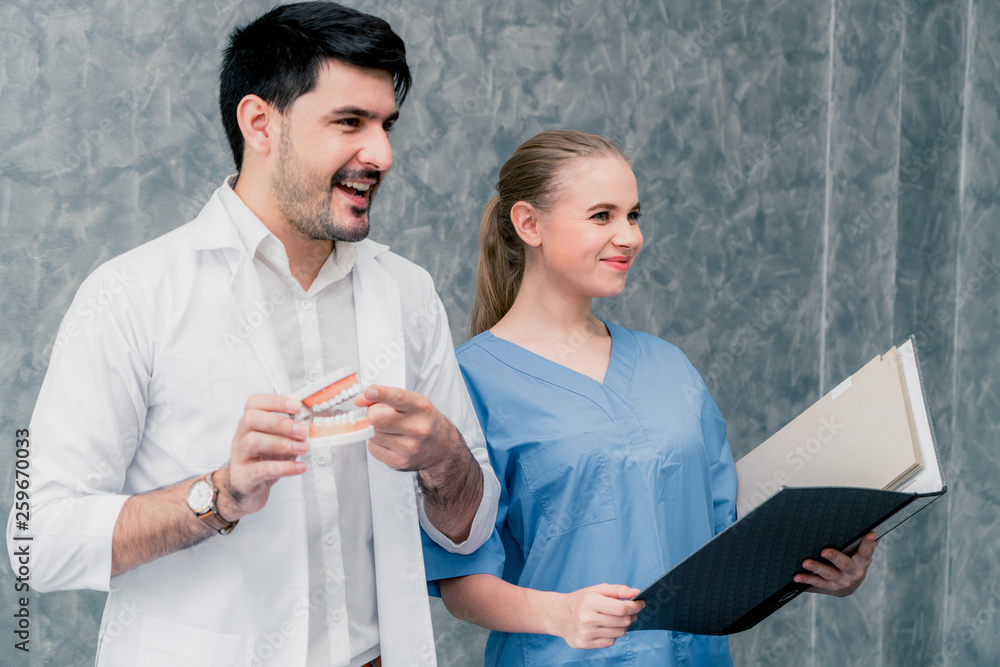 Dentist and nurse assistant working in dental office at the hospital. Dentistry concept.