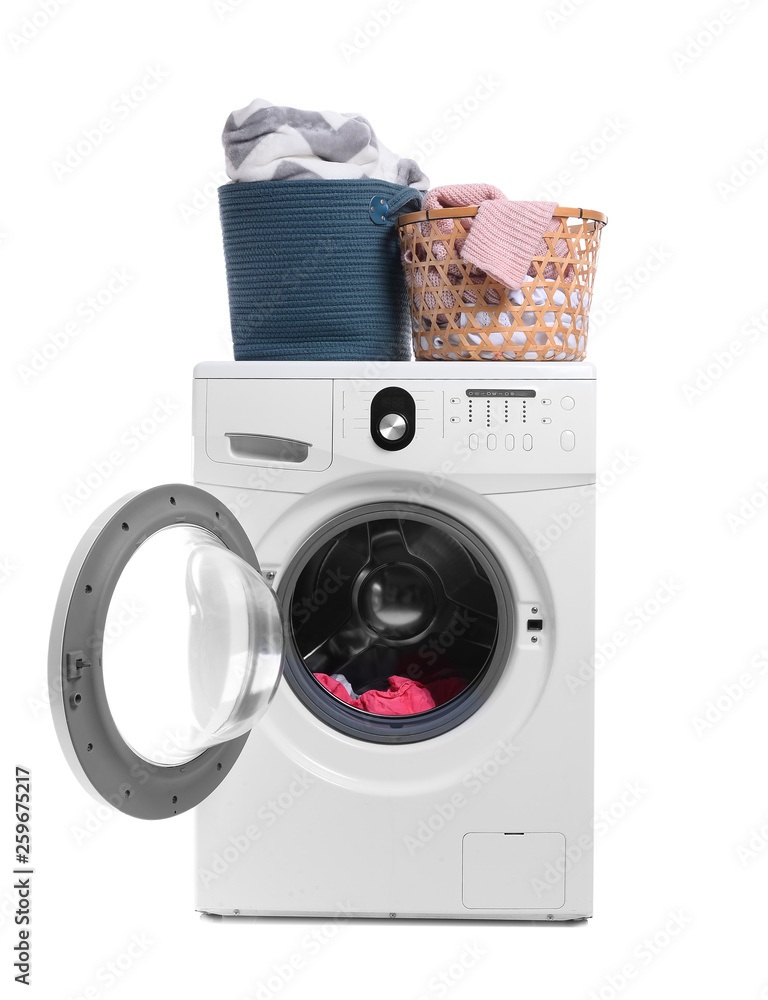 Modern washing machine and laundry on white background