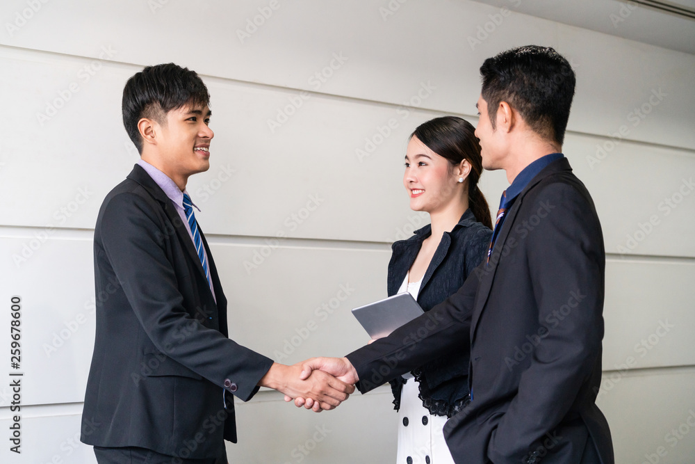 Business people agreement concept. Businessman do handshake with another businessman in the office m