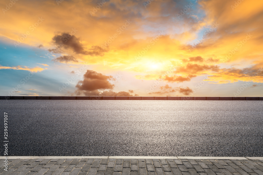 Empty asphalt road and beautiful sky clouds at sunset