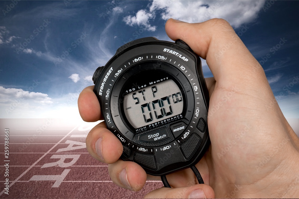 Stopwatch in Human Hand, sport concept