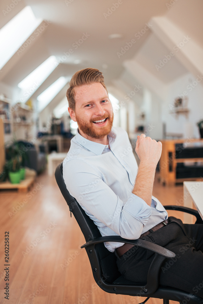 Portrait of a successful entrepreneur smiling at camera.