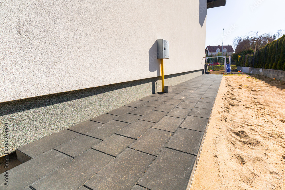 Concrete paver blocks laid near the house