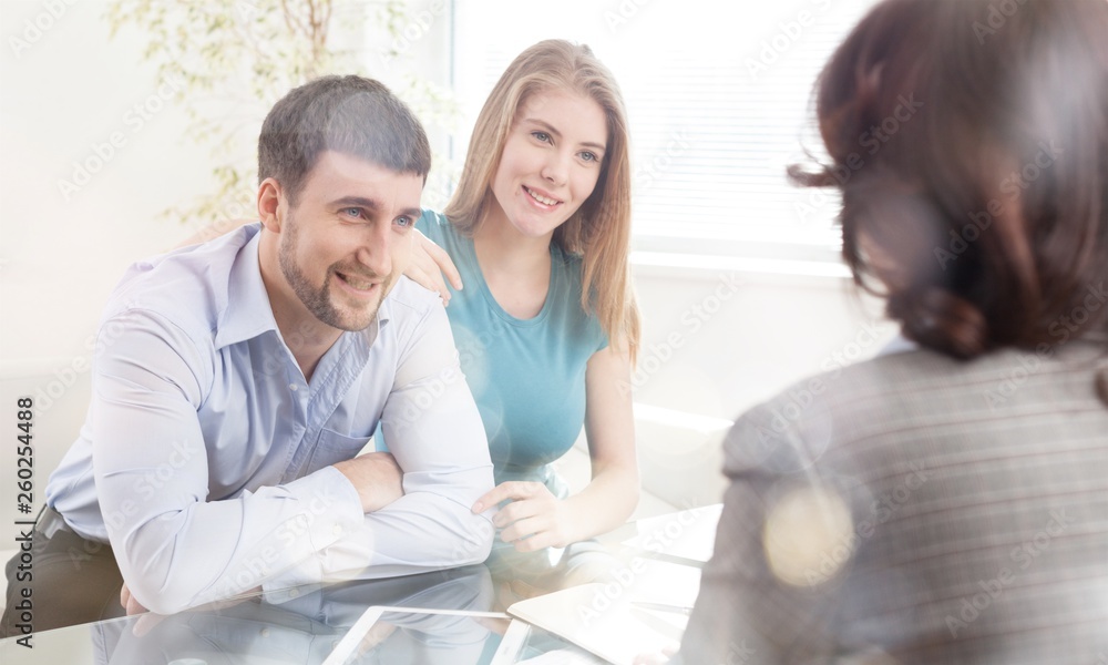 Young couple meeting financial adviser