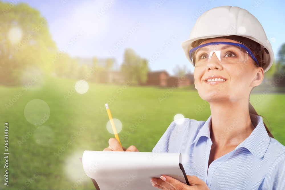 Portrait of young student of architecture  on background