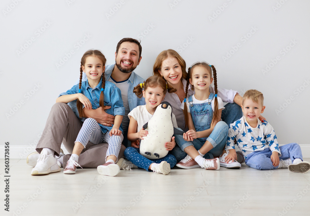 large family mother father and children sons and daughters on white background.