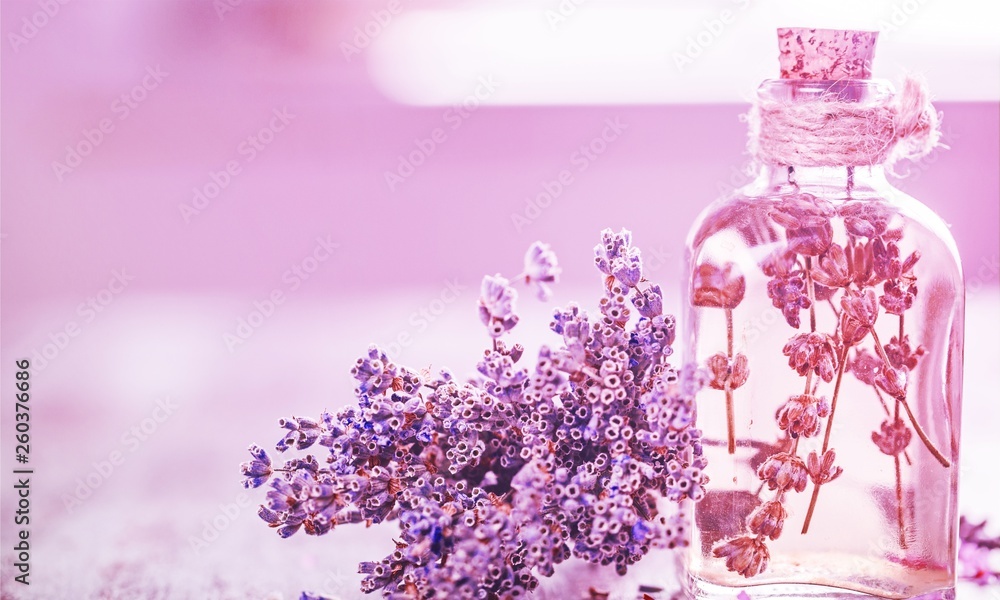 Lavender flowers and glass bottle isolated