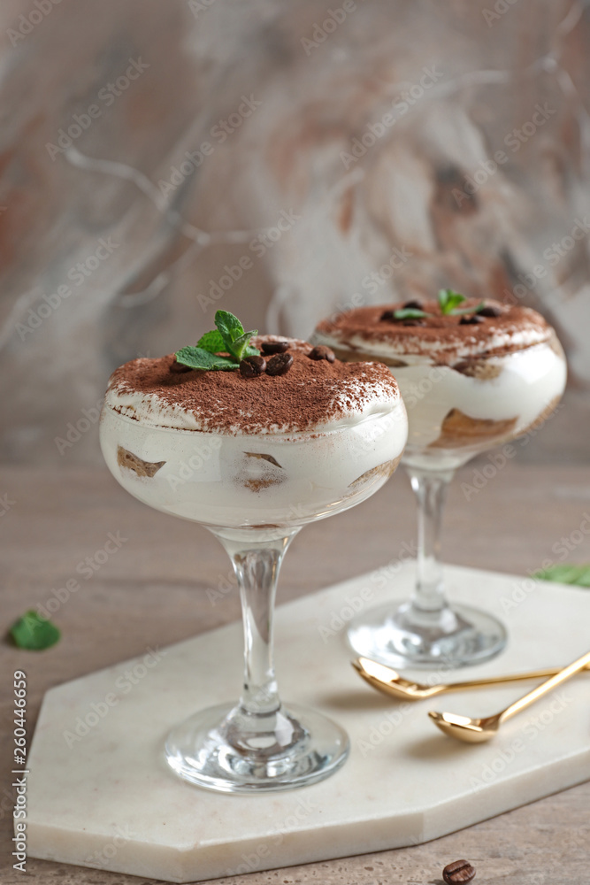 Tasty tiramisu on grey table