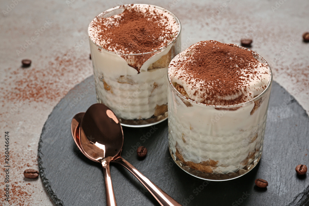 Tasty tiramisu on grey table