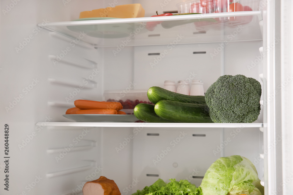 Open fridge full of different food