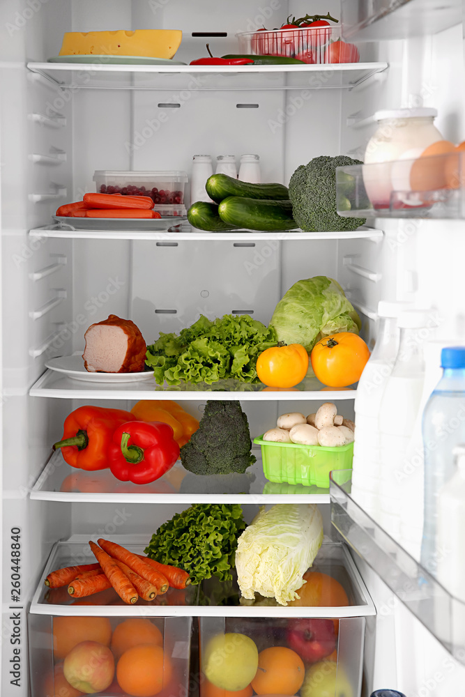 Open fridge full of different food