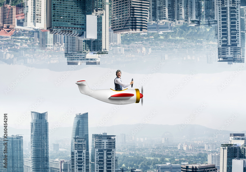 Businessman flying in small airplane