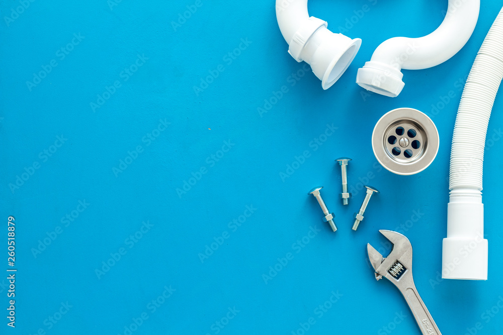 Plumber work with instruments, tools and gear on blue background top view mockup