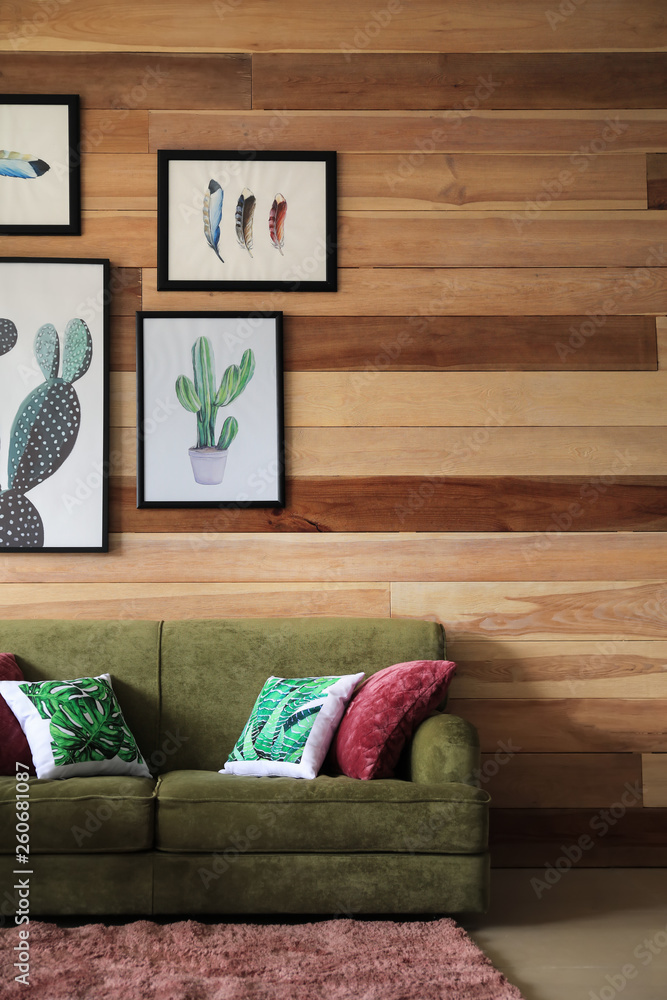 Soft couch near wooden wall in interior of living room