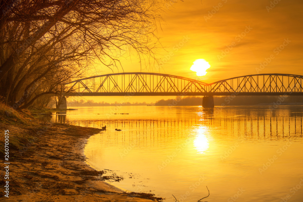 Amazing sunset over Vistula river in Torun, Poland