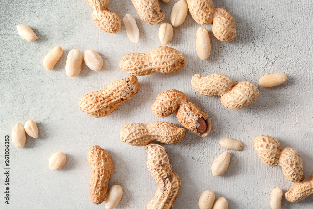 Tasty peanuts on grey background