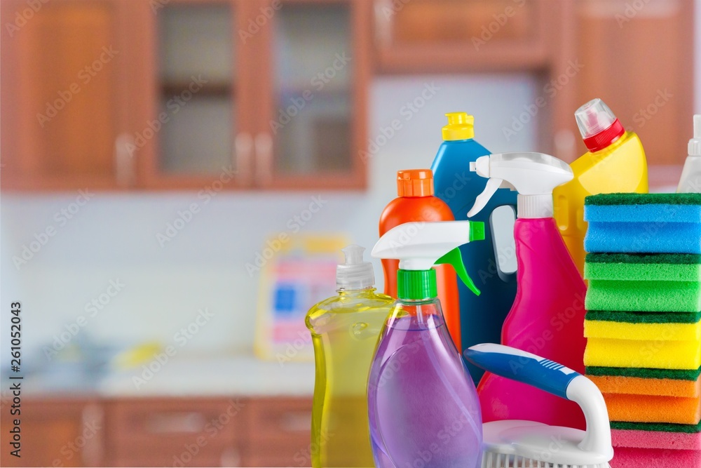 Plastic bottles, cleaning sponges and gloves  on background