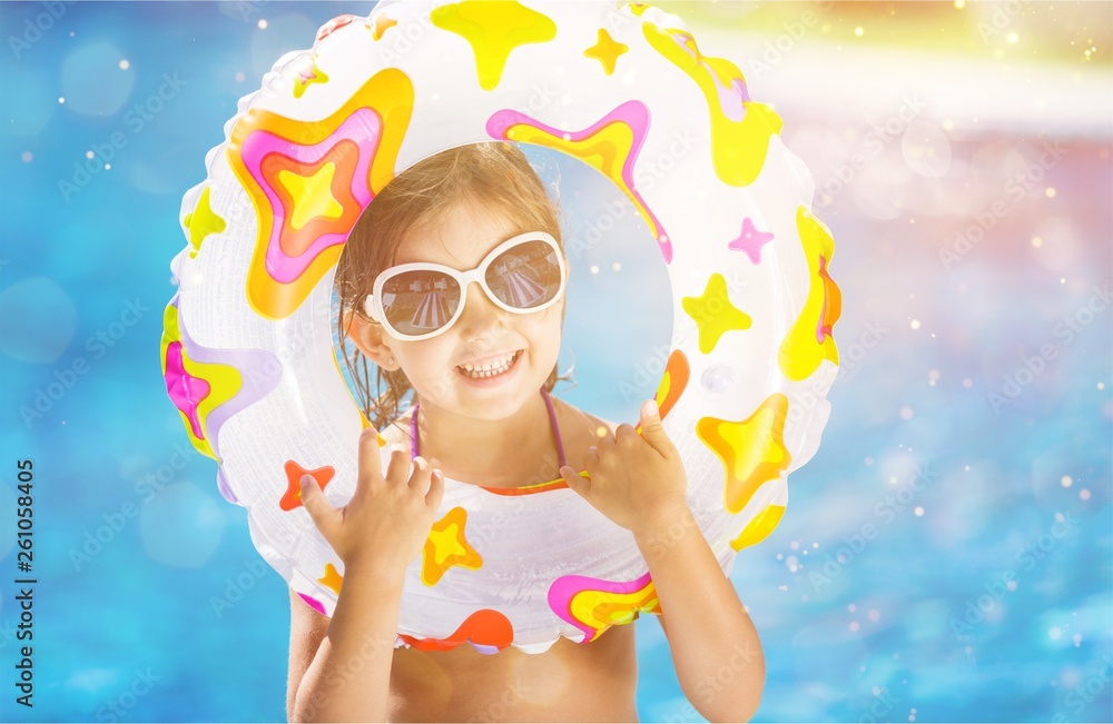 Beautiful little girl sunning at the pool