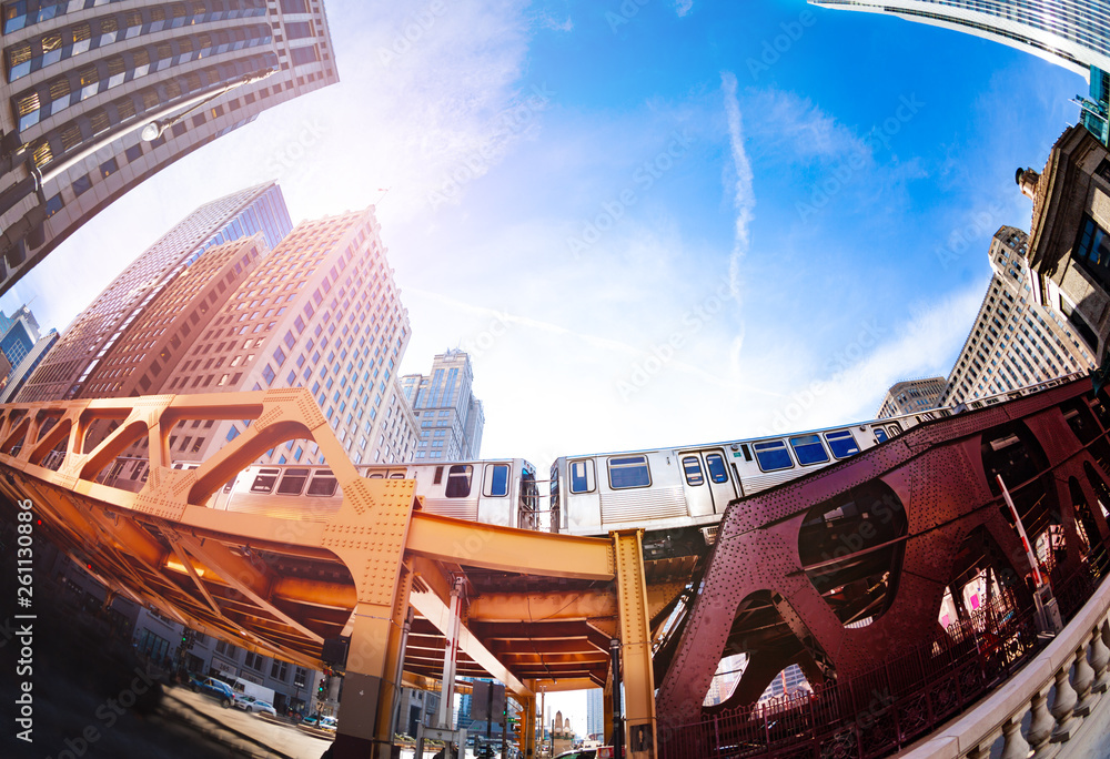 Train passing by over bridge of Chicago transport