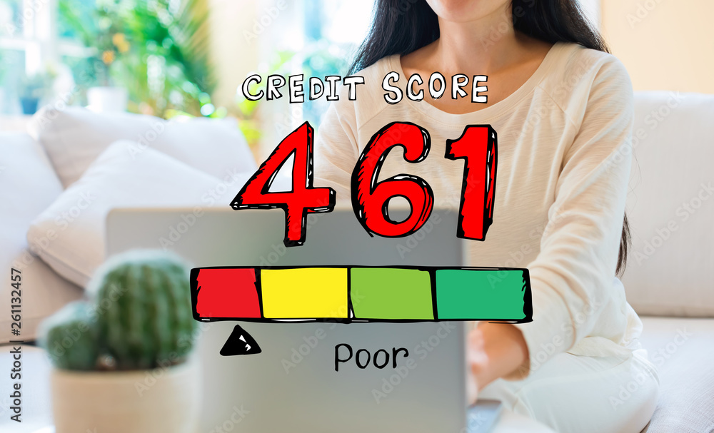 Poor credit score theme with woman using her laptop in her home office