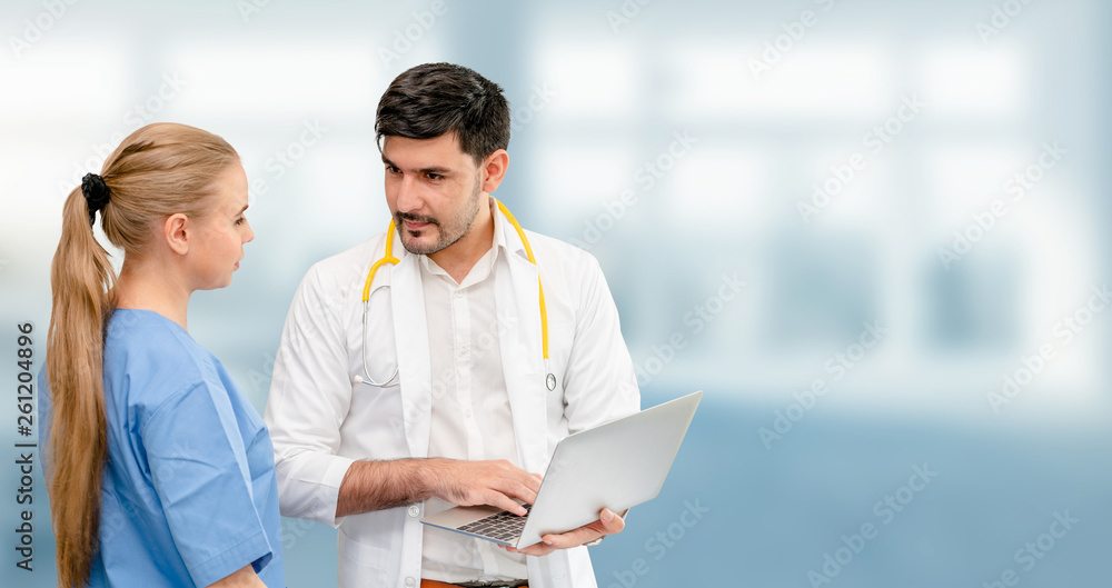 Doctors at hospital office working with another doctor. Healthcare and medical services.