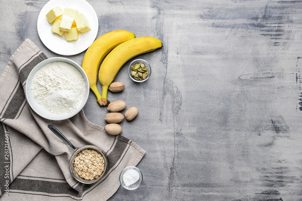 Ingredients for banana bread on grey table