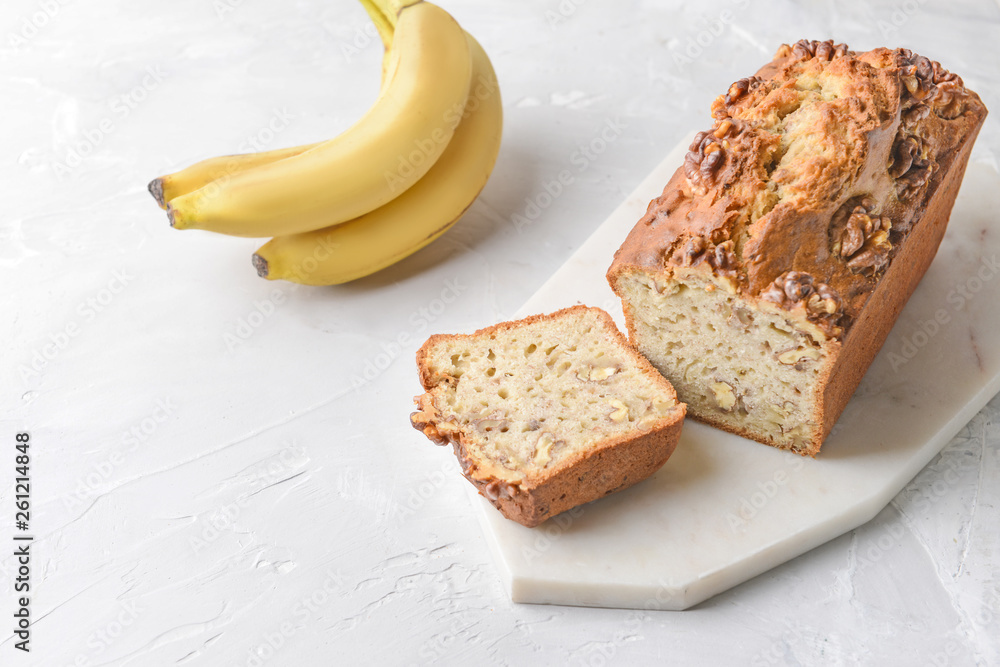 Tasty banana bread on white table