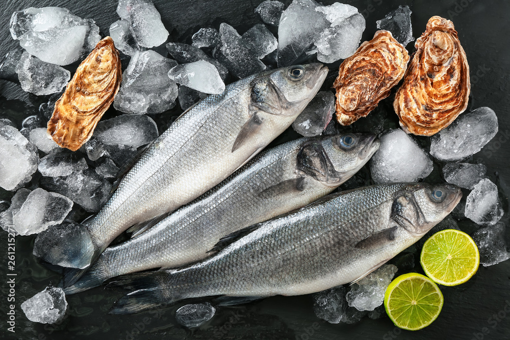 Fresh seafood with ice on dark background