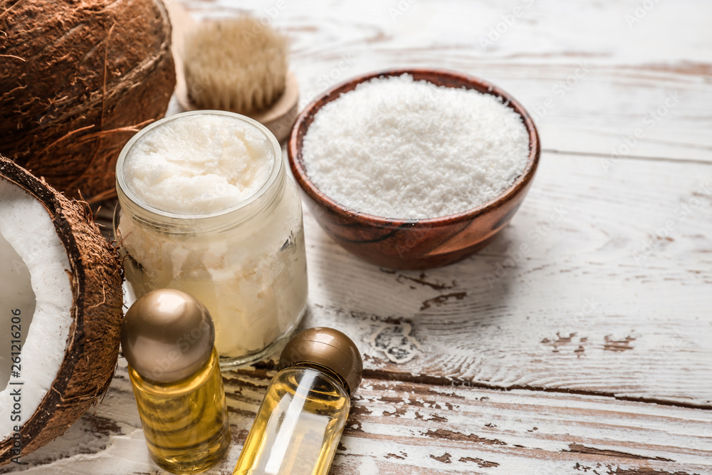 Composition with coconut oil on white wooden background