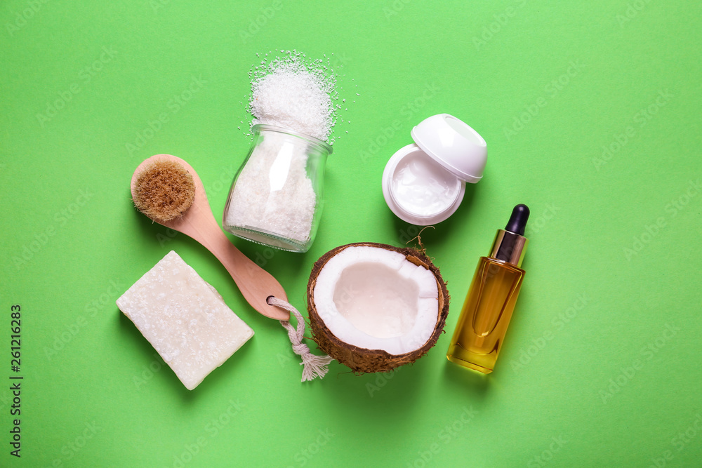 Cosmetics with coconut extract on color background