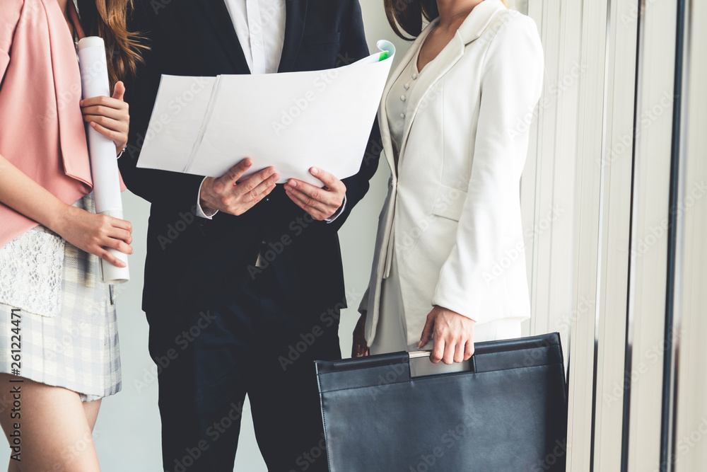 Businessman is in meeting discussion with colleague businesswomen in modern workplace office. People