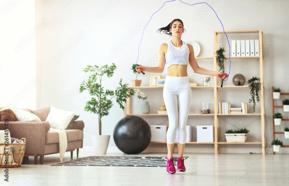  young woman doing fitness and sports at home