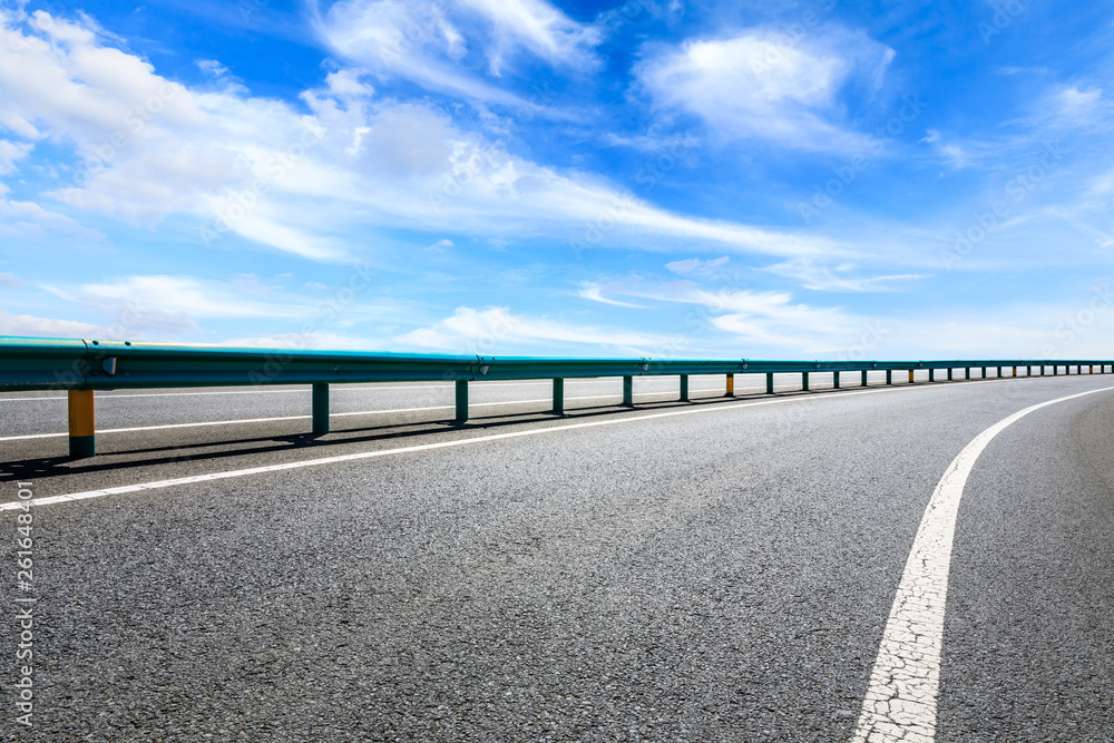 Empty asphalt road ground and blue sky with white clouds scene