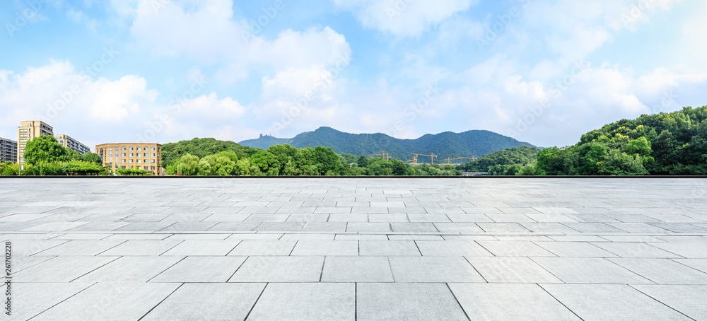 Empty square floor and green mountain with sky landscape