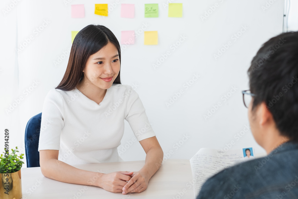 Asian business woman discussing/job interview with colleauge/boss for business meeting