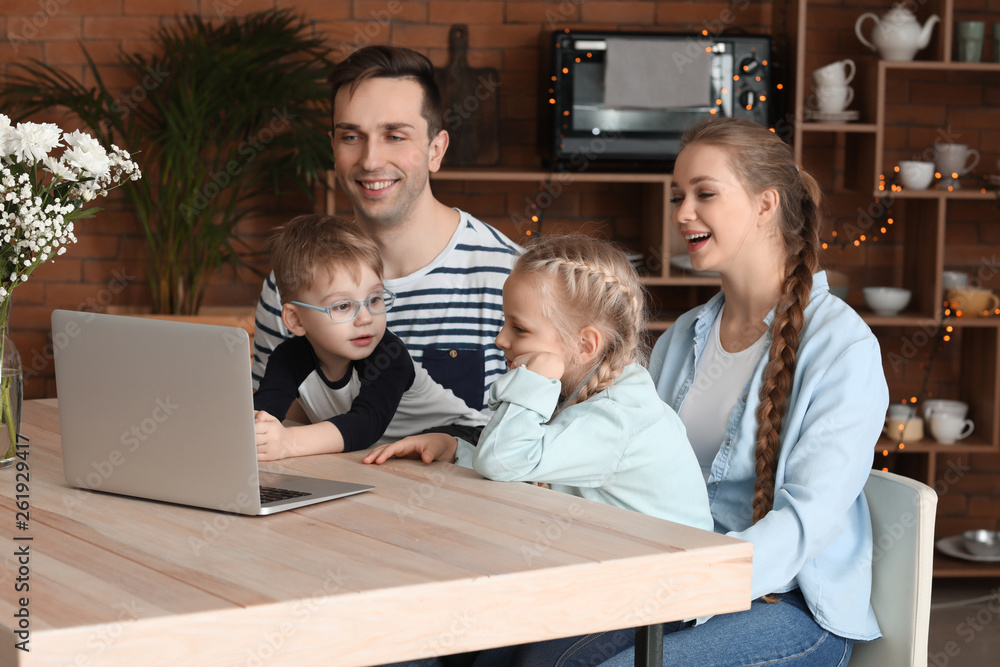 Happy family watching cartoons at home