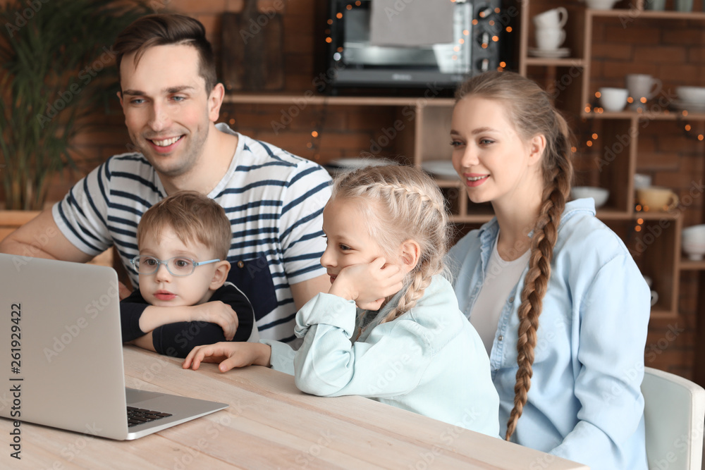 Happy family watching cartoons at home