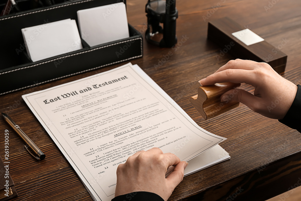 Female notary public working at table