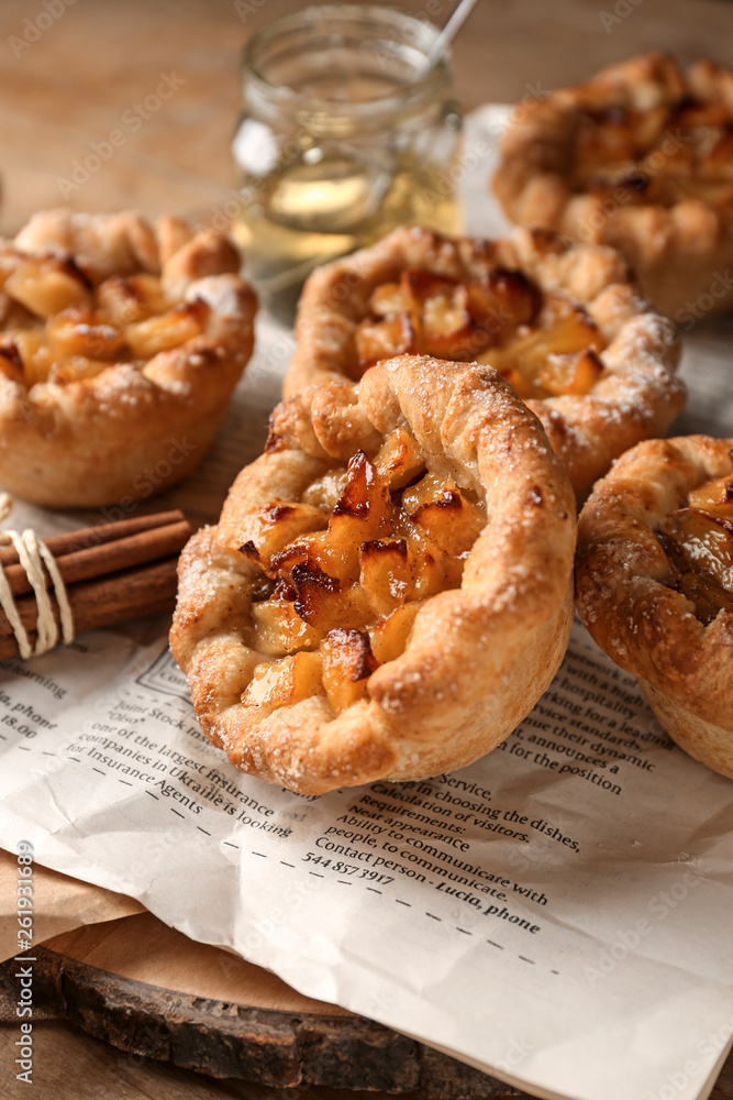 Tasty apple pies on table